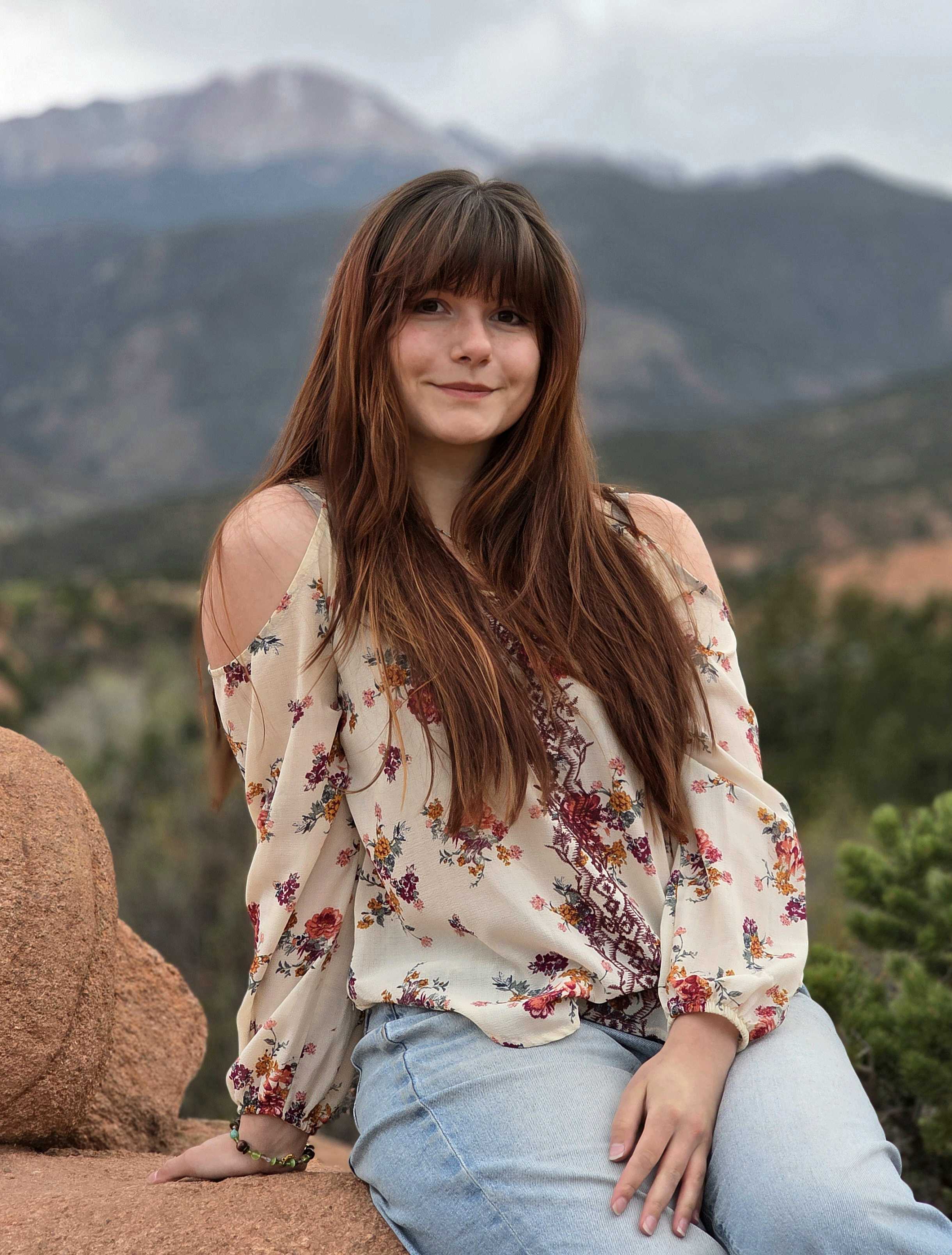 Tatiana in front of a mountain backdrop